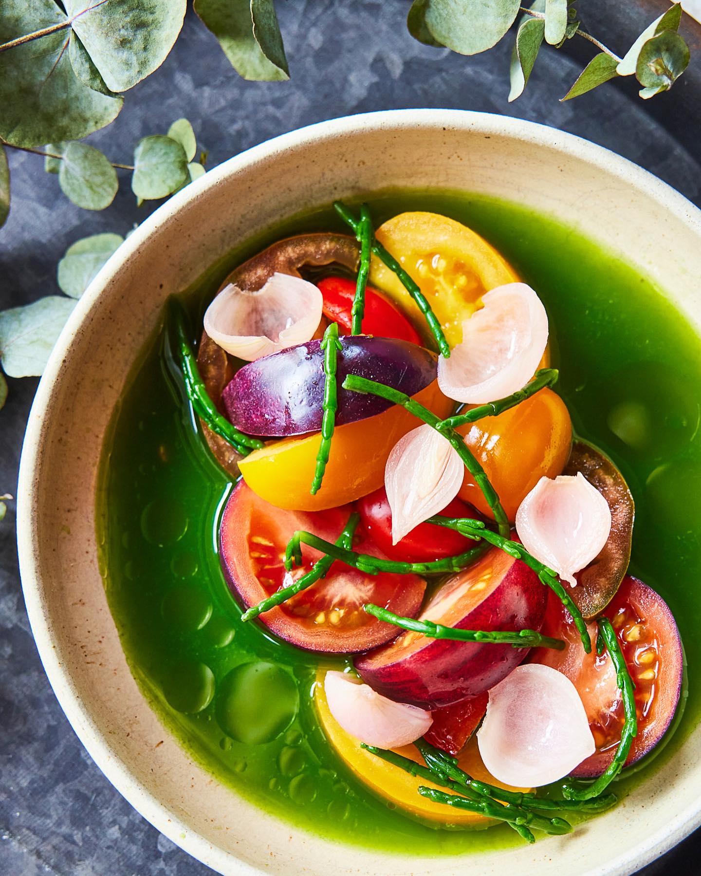 A beautiful dish of vegetables, including tomatoes and samphire