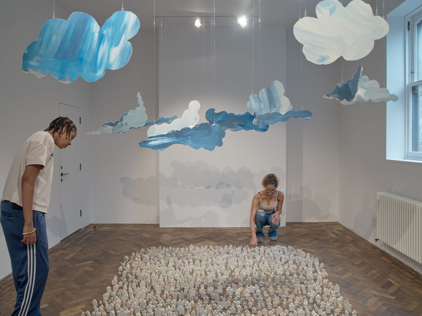 People in an exhibition at South London Gallery in Peckham London